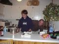 Casey and Alex cleaning up the kitchen at the condo